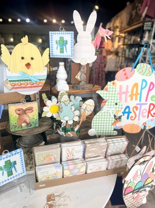 Display of Easter-themed decorations including a chick, bunny, and 'Happy Easter' sign.