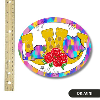 Colorful oval sticker with yellow shoes and roses, next to a ruler for scale.