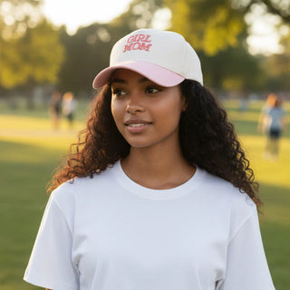 Woman wearing a 'Girl Mom' cap in an outdoor setting