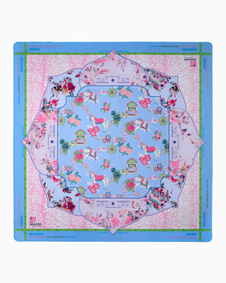 Colorful fabric swatch with floral and horse pattern on a blue border