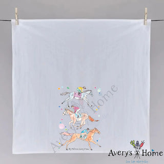 Tea towel with horse and jockey design hanging on a gray background