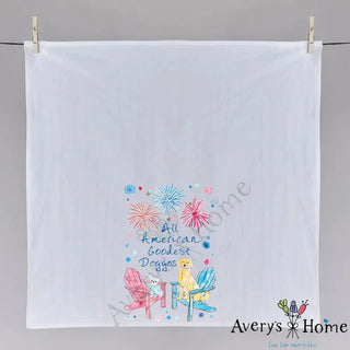 White towel with colorful design and text, hanging on a gray background