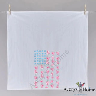 White towel with floral pattern hanging on a gray background, branded 'Avery's Home'.