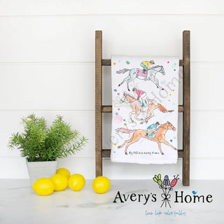 Towel with horse and rider design on a wooden ladder against a white wall, with 'Avery's Home' branding.