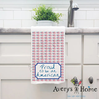 Towel with American flag pattern and text 'Proud to be an American' on a kitchen counter, with 'Avery's Home' branding.