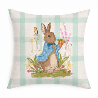 Decorative pillow with a bunny holding carrots on a checkered background