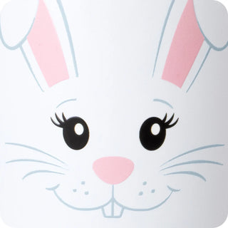 A close-up of a white bunny face illustration with pink inner ears, black eyes with eyelashes, a pink nose, and light blue whisker details on a white background.