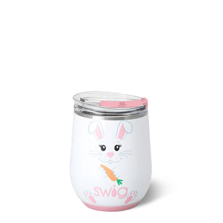 A white insulated stemless tumbler with a clear lid and pink accents, featuring a cartoon bunny holding a carrot and the word 'swag' in pink at the bottom, on a white background.