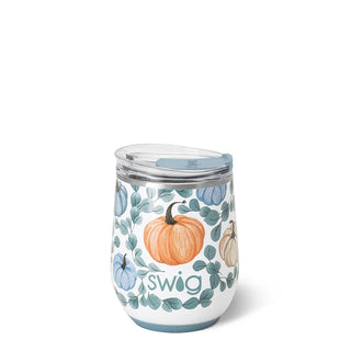 A white insulated stemless tumbler with a clear lid and a light blue interior, decorated with watercolor-style orange pumpkins, blue pumpkins, and green leaves. The word 'swig' is printed in a green script font on the front.