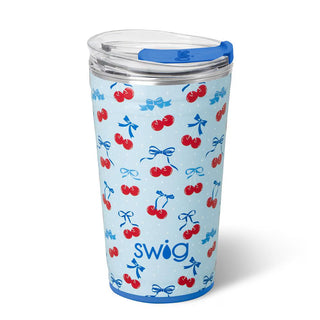 Swig tumbler with cherry and bow pattern on a light blue background