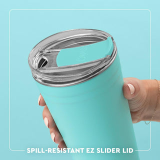 Turquoise tumbler with a spill-resistant EZ slider lid held by a hand against a light blue background.