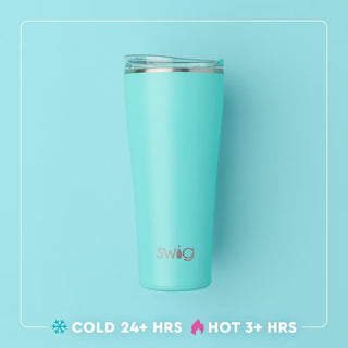 Turquoise tumbler with silver rim on a light blue background, featuring the Swig brand.