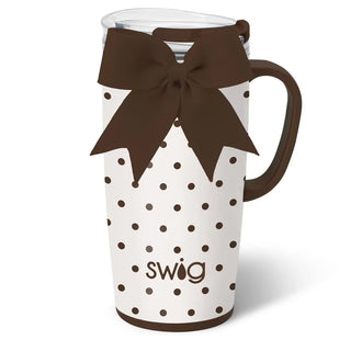 White mug with brown polka dots and a brown bow, featuring the 'Swig' brand.
