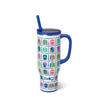 Colorful patterned mug with handle and straw on a white background