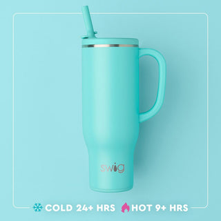 Turquoise mug with handle and straw on a light blue background, featuring the Swig brand.
