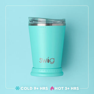 Turquoise tumbler with 'Swig' branding on a light blue background