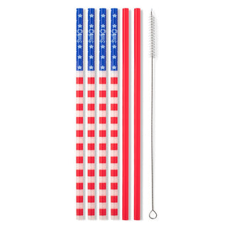 Set of four American flag-themed straws with a cleaning brush on a white background
