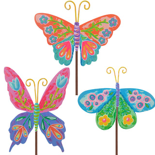Colorful butterfly-shaped garden stakes on a white background