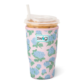 Reusable cup with floral pattern and straw on a white background