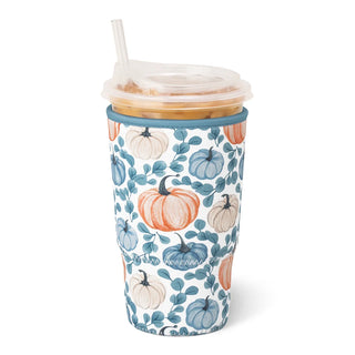 A tall insulated tumbler with a clear lid and straw, featuring a watercolor-style autumn pattern of orange, blue, and cream pumpkins with teal-blue leaves on a white background.