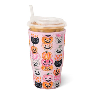 A pink insulated tumbler cup with a clear lid and straw, covered in a Halloween-themed pattern of jack-o'-lanterns, pumpkins, ghosts, and the words 'BOO' and 'Die'.