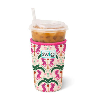 Palm Royale, where vibrant pink leopards prowl beneath swaying palm fronds on an ivory background cup coozie