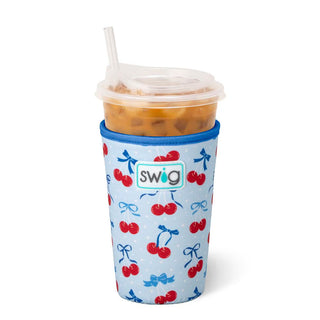 Swig cup with cherry and bow pattern on a white background