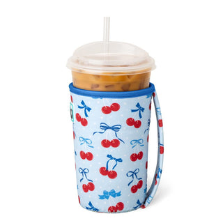 Tumbler with a colorful cherry and bow pattern on a white background