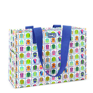 Colorful tote bag with a pattern and blue handles on a white background