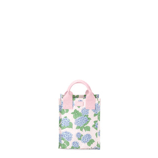 Small tote bag with floral pattern and pink handle on a white background