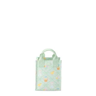 A light mint green insulated lunch bag with a repeating Easter-themed pattern of chicks, bunnies, and baskets, featuring top carrying handles and a small front logo patch.
