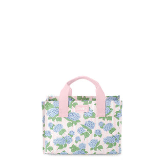Floral patterned bag with pink handles on a white background