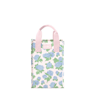 Floral tote bag with pink handle on a white background