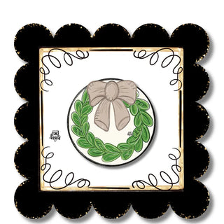 Decorative item with a bow and wreath design on a white background