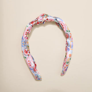 Floral patterned headband on a beige background