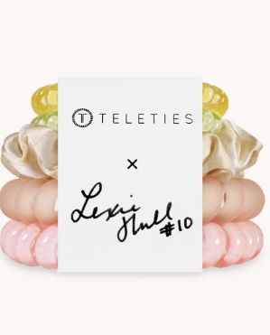 Set of pink hair ties with yellow ends and 'Teleties' branding on a white background.