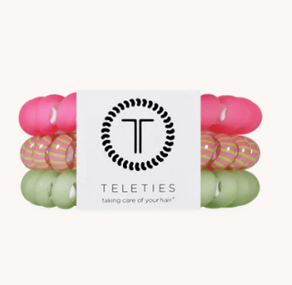 Set of colorful hair ties with a 'Teleties' brand label on a white background