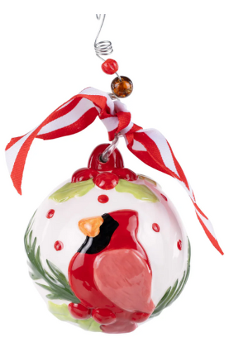 Decorative Christmas ornament with a red cardinal bird on a white background