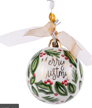 Christmas ornament with 'Merry Christmas' text and holly design on a white background