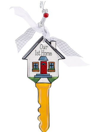 Decorative key-shaped ornament with a house design and 'Our 1st Home' text on a white background.