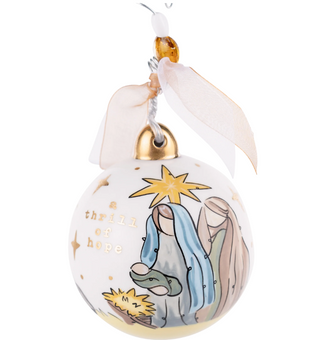 Decorative Christmas ornament with nativity scene design on a white background