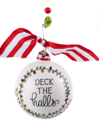 Christmas ornament with 'Deck the Halls' text and colorful lights, attached to a red and white striped ribbon.