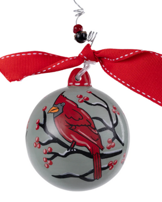 Decorative ornament with a red cardinal design on a white background