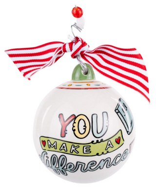 Decorative ornament with 'You Make a Difference' text and red and white striped ribbon on a white background