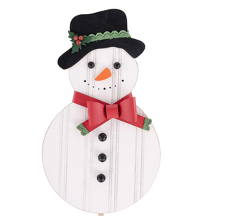 Wooden snowman decoration with a black hat, red bow tie, and black buttons on a white background