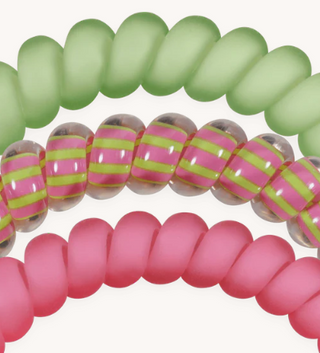 Close-up of colorful glass beads on a white background