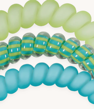 Close-up of colorful glass beads on a white background