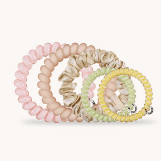 Set of colorful hair ties on a white background