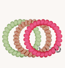 Set of colorful beaded bracelets on a white background