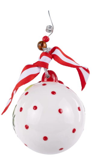 Decorative Christmas ornament with red polka dots and a striped ribbon on a white background